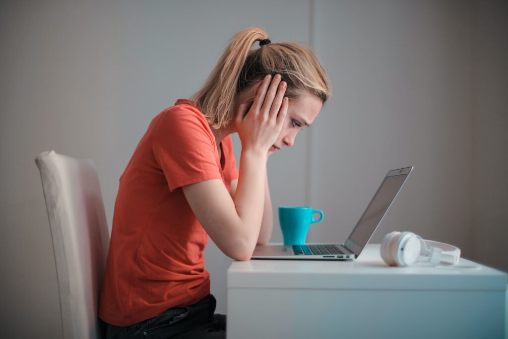 woman with anxiety sitting at a desk